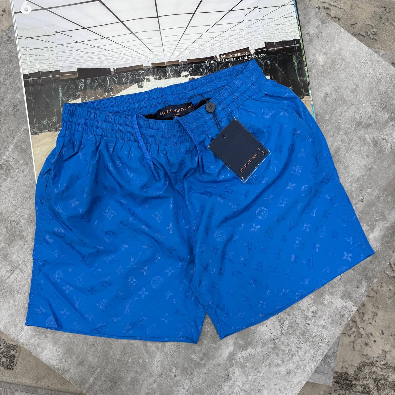 LVE MONOGRAM SWIM SHORTS - BLUE